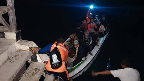 The 15 passengers and crew of the outrigger boat Sherylle are brought ashore after their vessel became partially submerged off Baluk-Baluk Island in Basilan province in the southern Philippines, February 27, 2026. The successful rescue operation was carried out by the crew of a commercial fishing vessel and Philippine Coast Guard personnel.
