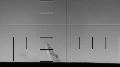 An image of Iranian warship IRIS Dena sinking after being struck by a US submarine