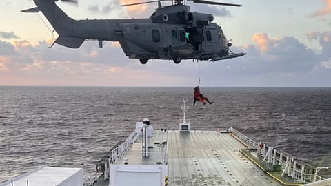 One of the rescued boaters being hoisted aboard a French helicopter from the deck of UECC's car carrier Autosun