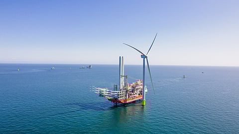 Cadeler's jackup vessel Wind Osprey installing the first wind turbine at the East Anglia Three offshore wind farm in the UK