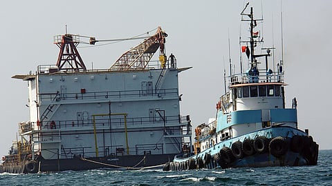 The barge Ocean 6 being towed by a tug in the Persian Gulf, October 8, 2006