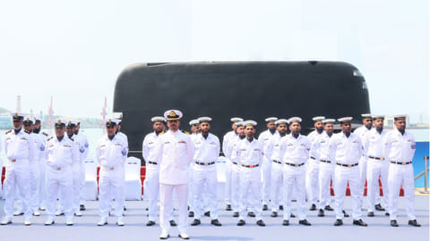 The inaugural crew of the Pakistan Navy submarine PNS Hangor stand at attention during their boat's commissioning ceremony in Sanya, China, April 30, 2026.