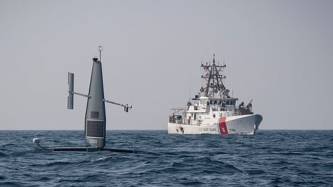 A Saildrone unmanned surface vehicle (USV) operates with the US Coast Guard fast response cutter USCGC Robert Goldman in the Arabian Gulf during Exercise Phantom Scope, October 7, 2022. During the bilateral exercise between the US and the UK, USVs operated in conjunction with crewed ships and naval command centers in Bahrain.