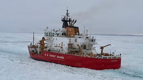 The US Coast Guard icebreaker USCGCC Mackinaw conducts track maintenance during a joint exercise with crew from Coast Guard Air Station Traverse City on the St Mary's River, February 5, 2026. Mackinaw was clearing ice in support of Operation Taconite, which aids the flow of commerce during the winter months on the Great Lakes.