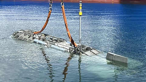 Datum's new midget submarine being lowered into the water