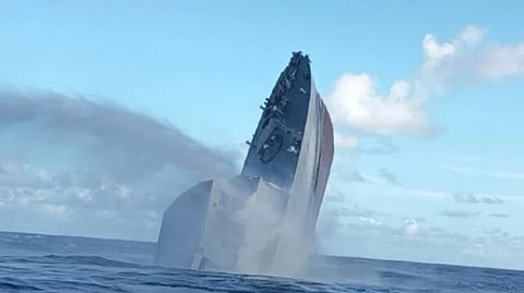 The Seychelles Coast Guard patrol boat PS Topaz sinks stern first after being scuttled to serve as an artificial reef in the Indian Ocean, May 9, 2026.