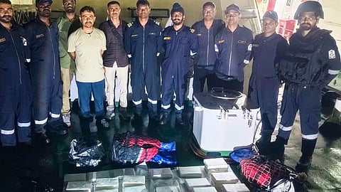 Indian Coast Guard and Gujarat Police personnel with the seized cocaine