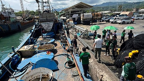 Officials of Zamboanga City in the southern Philippines inspect the fishing vessel Kevin, where four workers suffered fatal injuries possibly as a result of suffocation on June 11, 2026.