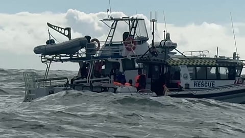Marine Rescue NSW volunteers assess the situation on the stranded dive boat, June 13, 2026.