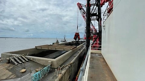 A clamshell bucket aboard the DB Catalina transfers dredged sediment into a material barge during annual maintenance dredging operations at Military Ocean Terminal Sunny Point, North Carolina. 