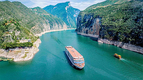 Cruise ship sailing along a river