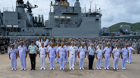 US, Canadian, and Thai personnel stand in front of the Royal Thai Navy frigate HTMS Taksin on the opening day of the 32nd iteration of Cooperation Afloat Readiness and Training Thailand, July 6, 2026.