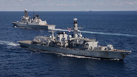 The Royal Navy Type 23 frigate HMS Richmond (foreground) sails past the Type 45 destroyer HMS Diamond.