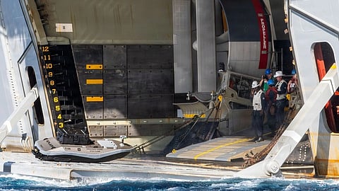 A digitally crewed surface vessel enters the well deck of the Wasp-class amphibious assault ship USS Essex (LHD 2) during a logistics demonstration as part of Exercise Rim of the Pacific 2026 off the coast of Oahu, Hawaii, July 7, 2026. 