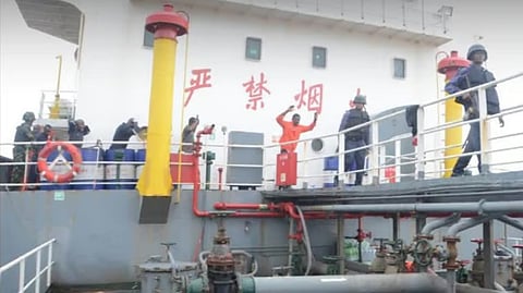 Nigerian Navy personnel take the crew of the tanker Filia into custody on July 23, 2026, over allegations that the ship had illegally loaded crude worth around US$490,000.