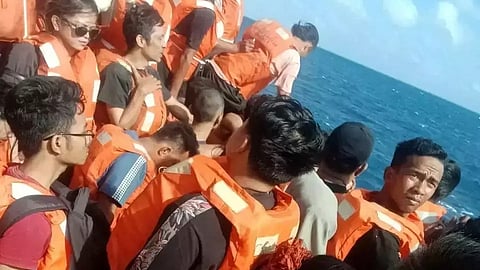 Passengers on the deck of the KMP Mutiara Sentosa 2 ferry, which caught fire off Madura Island on August 2, 2026.