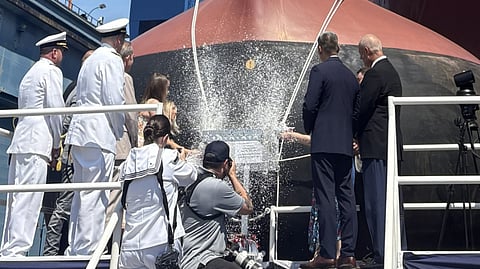Smashing of the ceremonial champagne bottles against the hull of the guided-missile destroyer USS William Charette during her christening ceremony, August 1, 2026