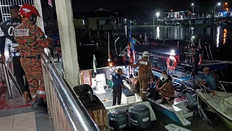Fire and Rescue Department of Malaysia personnel attend to some of those who were injured by a vessel collision that occurred near the Kuala Sungai Mersing Estuary in Johor State on August 31, 2026. The incident also left two people dead.