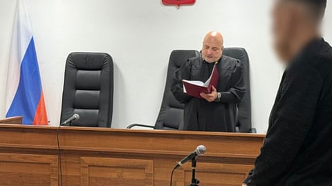 The defendant (nearest to camera) at his sentencing hearing