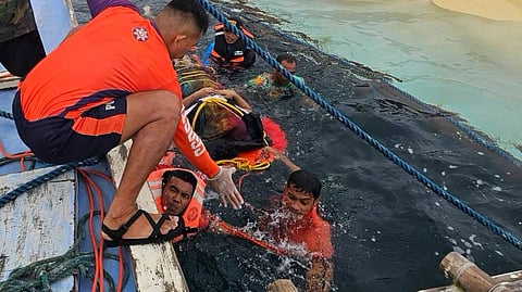 Philippine Coast Guard personnel help rescue some of the survivors of the capsizing of the banca-type boat San Agustin IV off the Philippines' Antique province, September 6, 2026. All but one of the boat's nine occupants survived the incident.