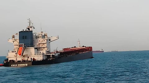 The Liberian-flagged bulk carrier KMax Emperor sits low in the water off India's Mundra Port following a collision with the Barbados-registered ship True Mariner, September 11, 2026.