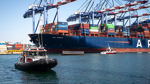 A Los Angeles Fire Department 40-foot small boat approaches a US Coast Guard Station Los Angeles-Long Beach 45-foot response boat-medium crew in Los Angeles Harbor, September 14, 2026. The US Coast Guard, Los Angeles Fire Department and Los Angeles Port Police responded to a report of three containers entering the water in Los Angeles Harbor during a container offload.
