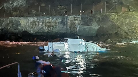 A grounded 22-foot recreational vessel rests on rocks near Lime Point Lighthouse in San Francisco, Sept. 17, 2026.