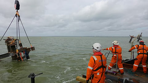 Salvage teams preparing one of Richard Montgomery's masts for removal