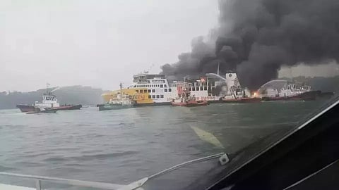 Other vessels attempt to extinguish the blaze on the ferry Batumandi near Indonesia's Merak Port, October 20, 2026