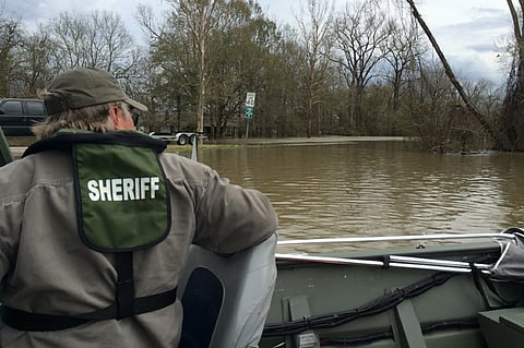 A West Feliciana Parish Sheriff's deputy on a rescue boat (Photo: WFPSO.org)