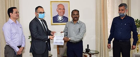 J&K LG GC Murmu hands over a cheque for Rs 1 Crore to the Registrar General of the J&K High Court