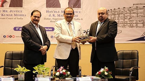 Justice JK Maheshwari (centre) with Justice PK Mishra (right) and HNLU VC Prof. Vivekanandan (left)