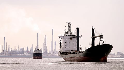 Photo of vessel off Singapore, with refinery in background