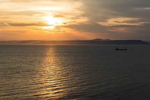 Photo of vessel at sunset
