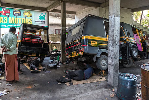 Photo of auto rickshaw repair garage in India