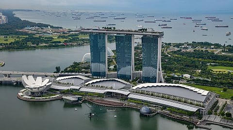 Photo of Marina Bay Sands, and the Singapore waterfront filled with vessels 