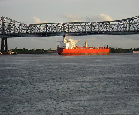 Photo of vessel passing under bridge along Mississipe River