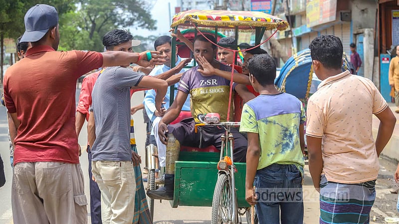 Locals bar battery-run rickshaws in Dhaka's Jurain, except those driven by people with disabilities, on Friday, Aug 26, 2022, two days after a rickshaw hit and killed a school student in the area.