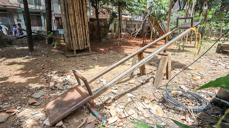 Children's swings, slides and various rides have become rusty and accumulated dust in the locked park of Dhaka North City Corporation between Block D and E of Mirpur 12. Photo: Asif Mahmud Ove