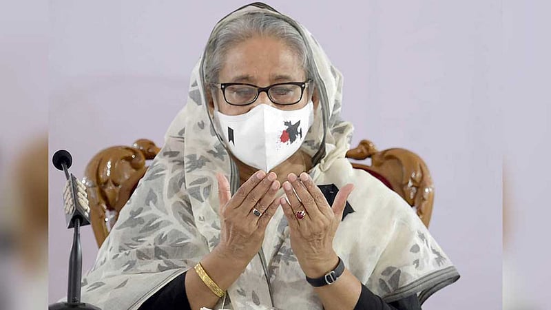 Prime Minister Sheikh Hasina prays for the victims of the the Aug 21 grenade attack on the 18th anniversary of the event on Sunday. Photo: PID