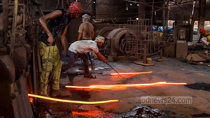 Workers make flat bars at the Al-Amin Re-Rolling Mill in Dhaka’s Postagola. Photo: Mahmud Zaman Ovi