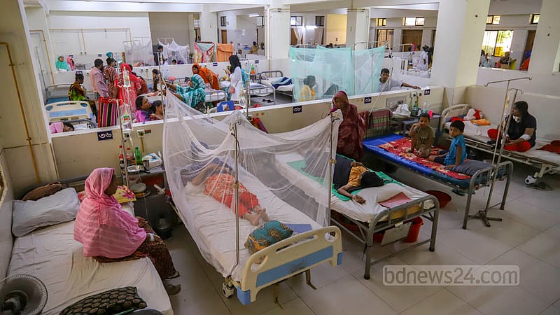 Dengue patients are kept inside mosquito nets at Shaheed Suhrawardy Medical College Hospital.