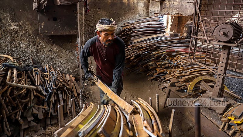 The cost of the old iron used to make flat bars at the Al-Amin Re-Rolling Mill in Dhaka’s Postagola has risen by TK 10-15 from the old price of Tk 58 per kg in the past two months. Photo: Mahmud Zaman Ovi