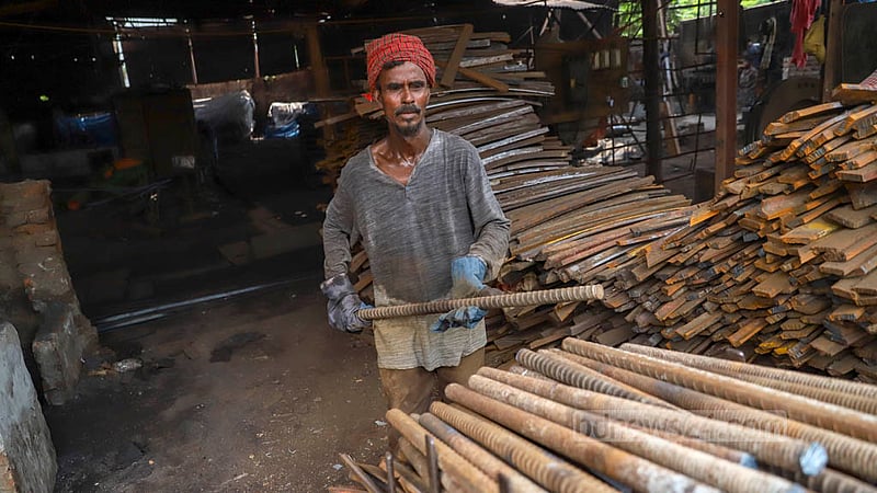 Old iron goes through several rounds of scrutiny before it is used for the making of flat bars at the Al-Amin Re-Rolling Mill in Dhaka’s Postagola. Photo: Mahmud Zaman Ovi
