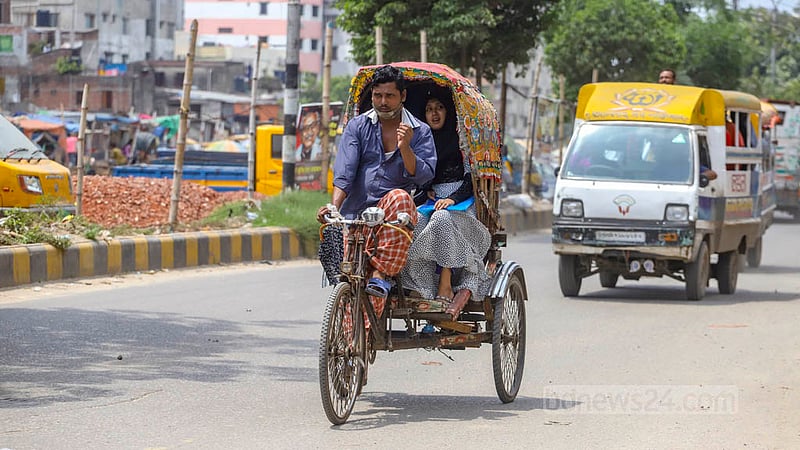 An unauthorised battery-run rickshaw transporting passengers in Dhaka's Jurain.