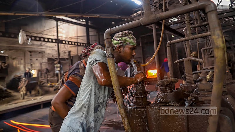 Workers, tired after working in the heat of the Al-Amin Re-Rolling Mill in Dhaka’s Postagola, take a break for a drink of water. Photo: Mahmud Zaman Ovi