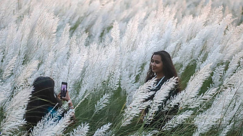 Many people snap photos to commemorate their trips to the Kans fields in Dhaka's Aftabnagar.