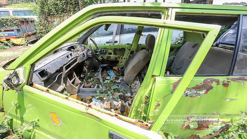 Vehicles impounded by the police at different times occupy a section of the Golartek playground in Mirpur.