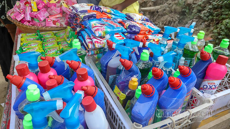 Low-income people buy cheap but counterfeit or substandard products from a street vendor in Dhaka as prices of popular brands rise sharply.