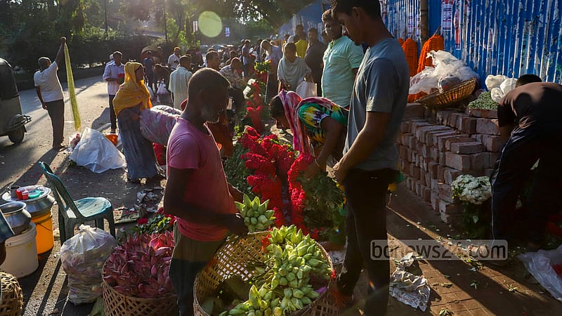 Flowers are on display on the footpath outside the market in Dhaka’s Shahbagh.